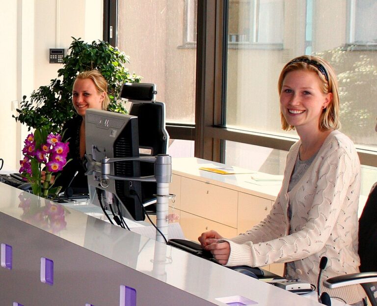 Office receptionist receiving documents